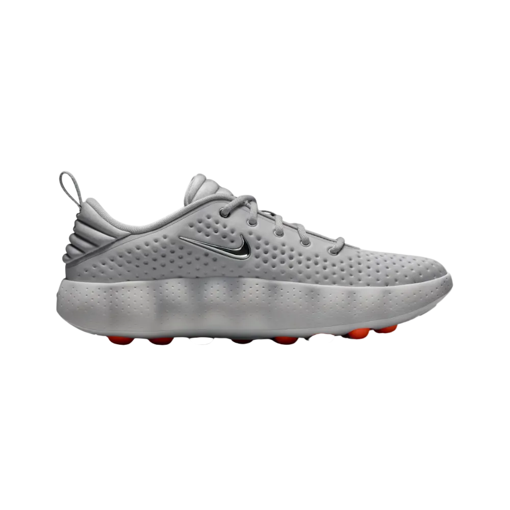 Tenis Nike Mind 002 Light Smoke Grey - vista lateral con cápsulas naranjas de amortiguación