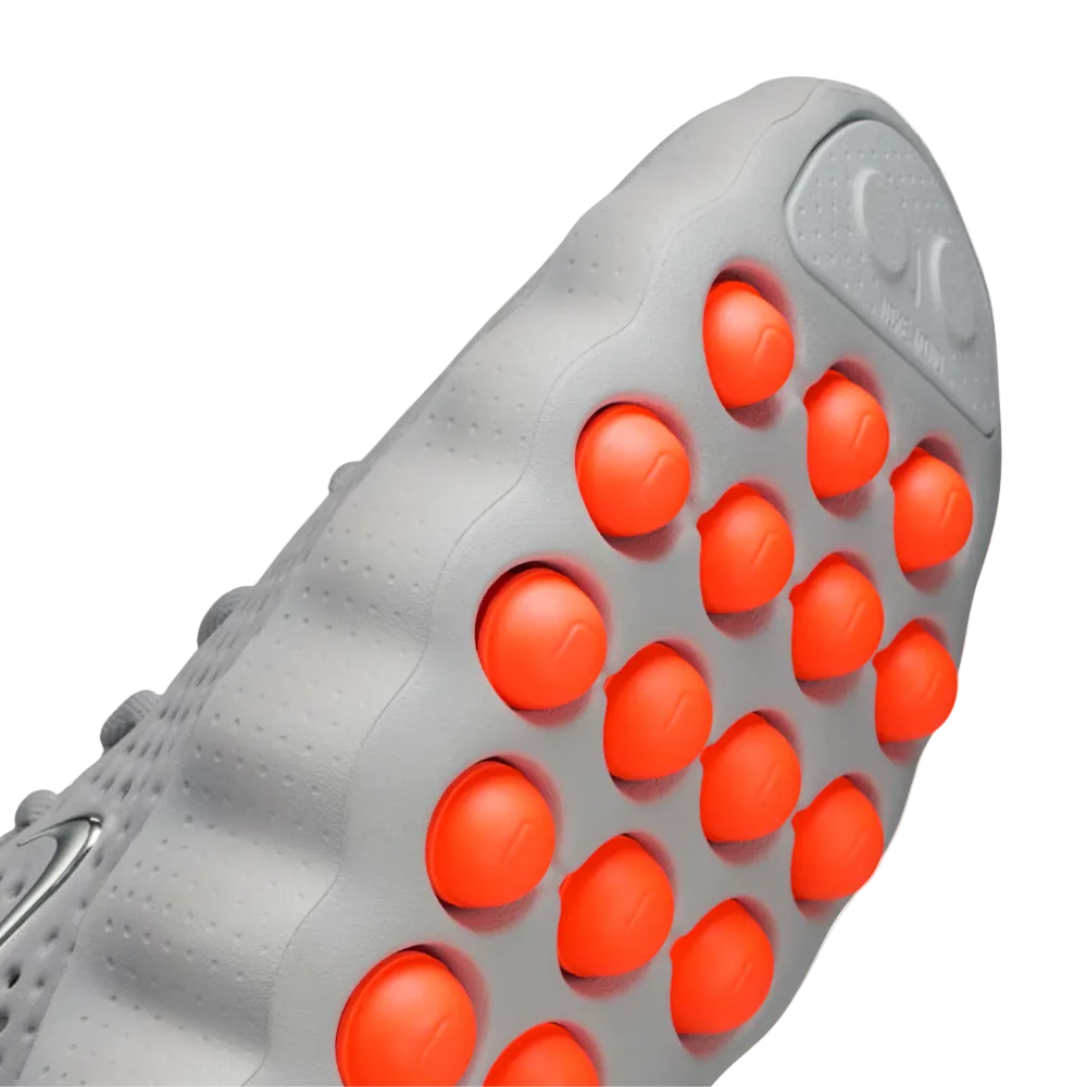 Detalle cápsulas naranjas Nike Mind 002 - tecnología de amortiguación reactiva que absorbe impactos